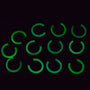 Green glow-in-the-dark mini clip-on hoop earrings displayed in grid layout on black background
