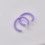 Purple mini glow clip-on hoop earrings displayed at an angle on white background showing clear acrylic accents