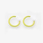 Yellow mini glow clip-on hoop earrings front view on white background
