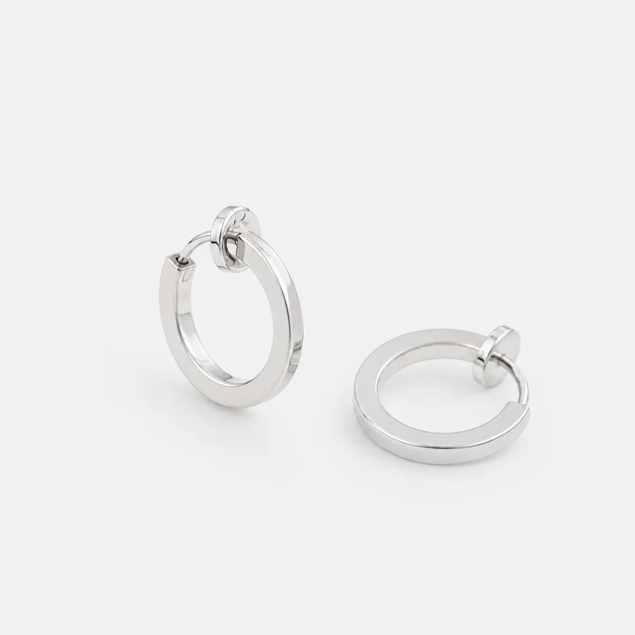 Lightweight and stylish Silver Mini Clip-On Hoop Earrings for men, available in 13mm and 15mm diameter options.