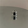 Minimalist Black Zirconia Band Ear Cuff in silver metal, front view on white background