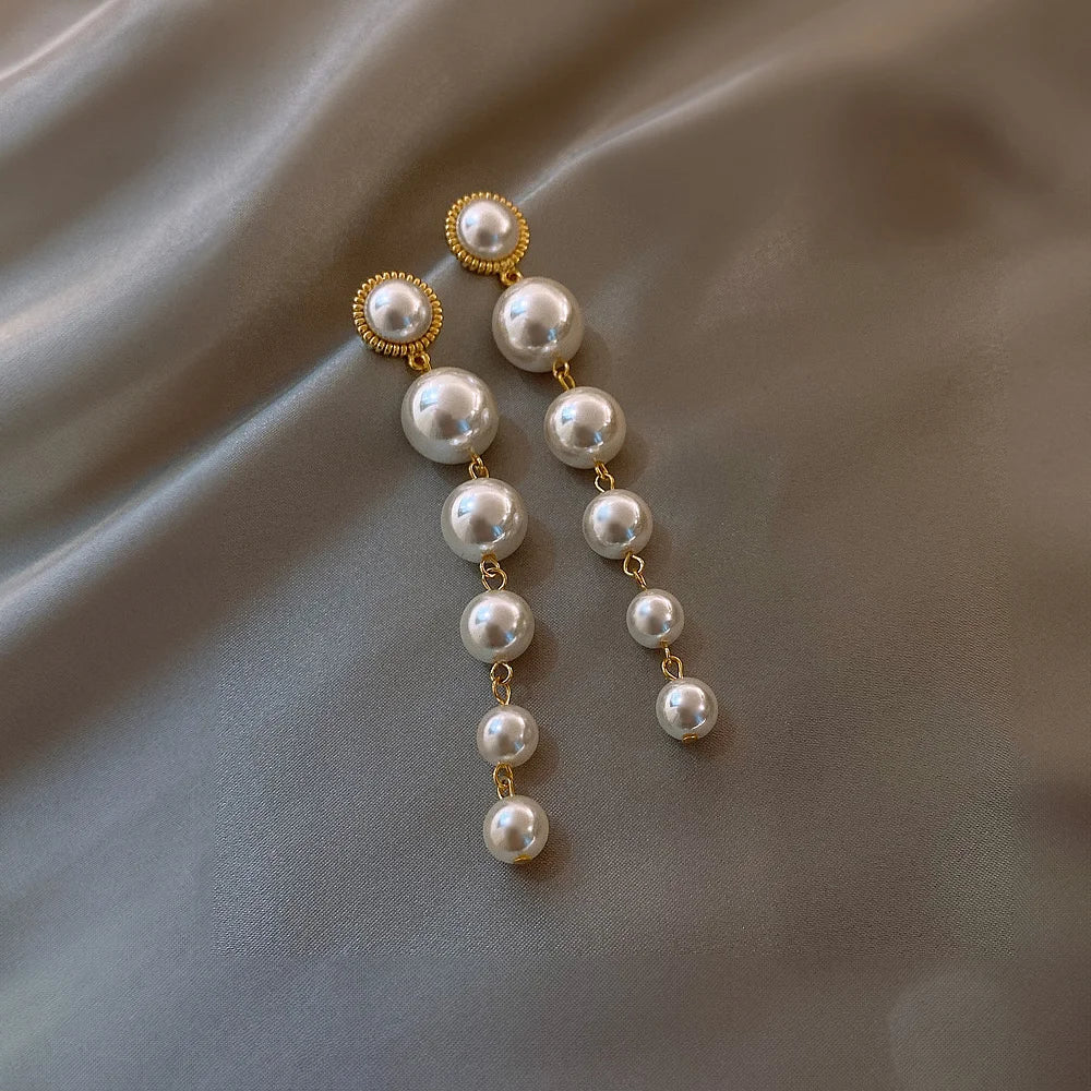 Faux pearl drop earrings with 15mm to 8mm pearls, ideal for bridal wear.