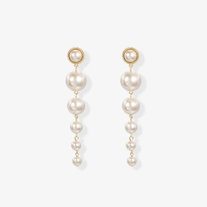 Elegant clip on pearl earrings with cascading faux pearls, perfect for weddings.