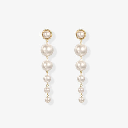 Elegant screw back clip on pearl earrings with cascading faux pearls, perfect for weddings.