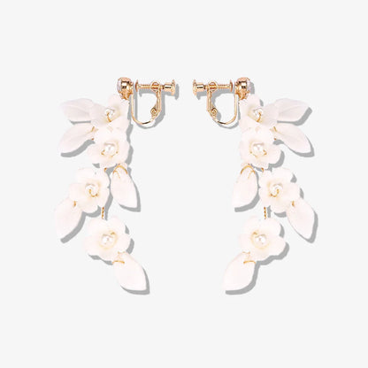 Petal Pearl Cascade Clip-On Earrings with light ceramic floral design and faux pearls.