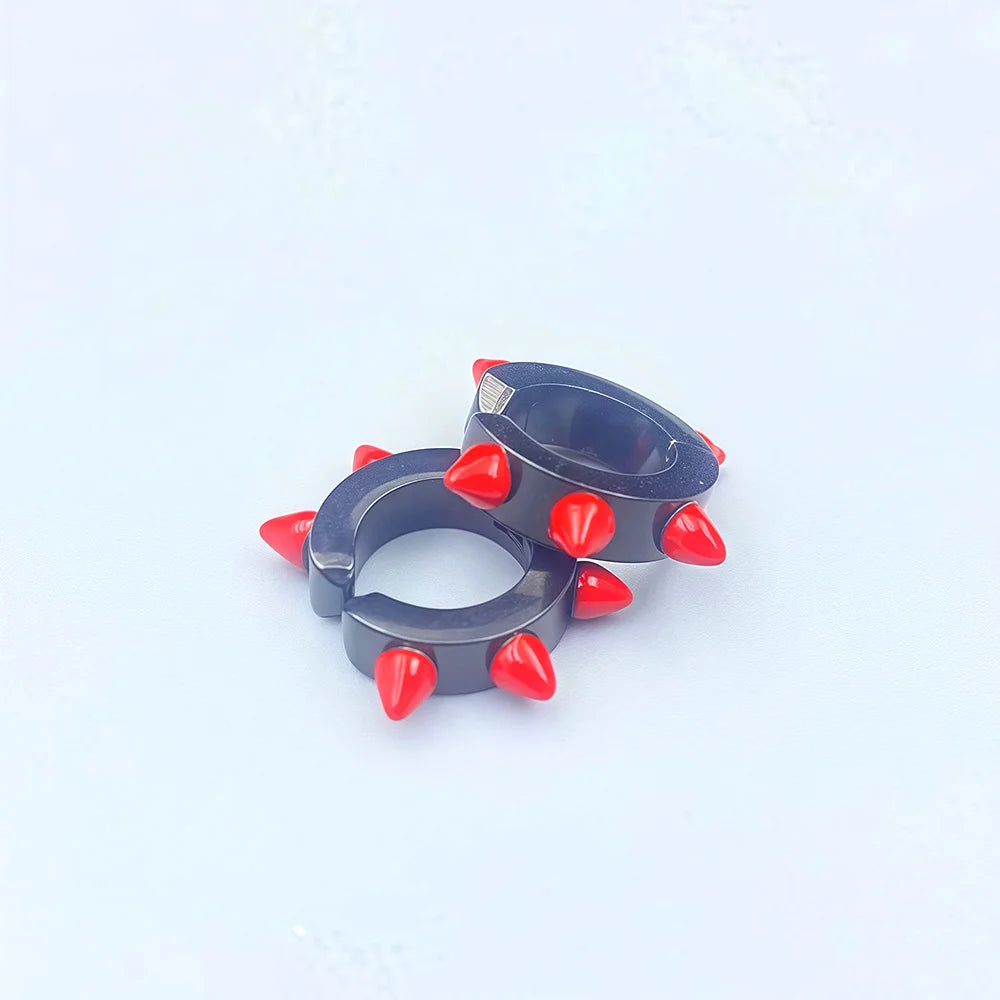 Unisex fake earrings with bold red spikes and blue hoop

