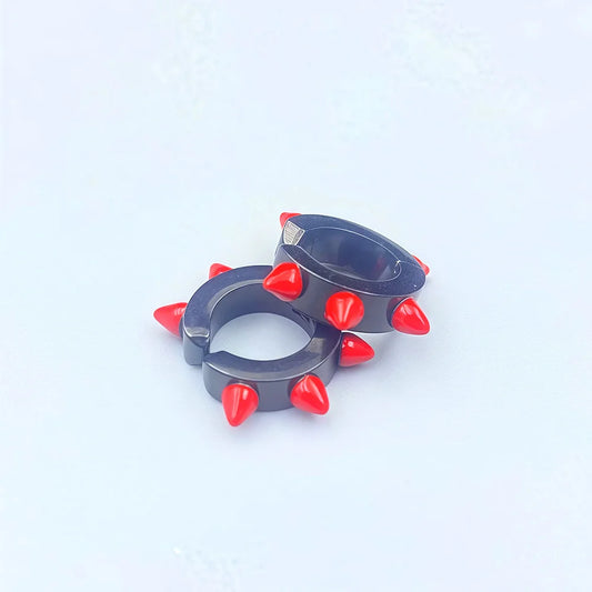 Unisex fake earrings with bold red spikes and blue hoop

