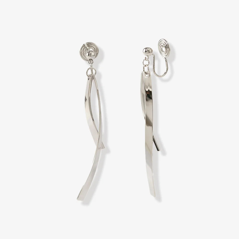 Silver ribbon dangle clip-on earrings front view on white background showing twisted metal straps