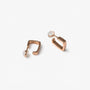 Rose gold square clip on hoop earrings showing the cushioned clip on closure
