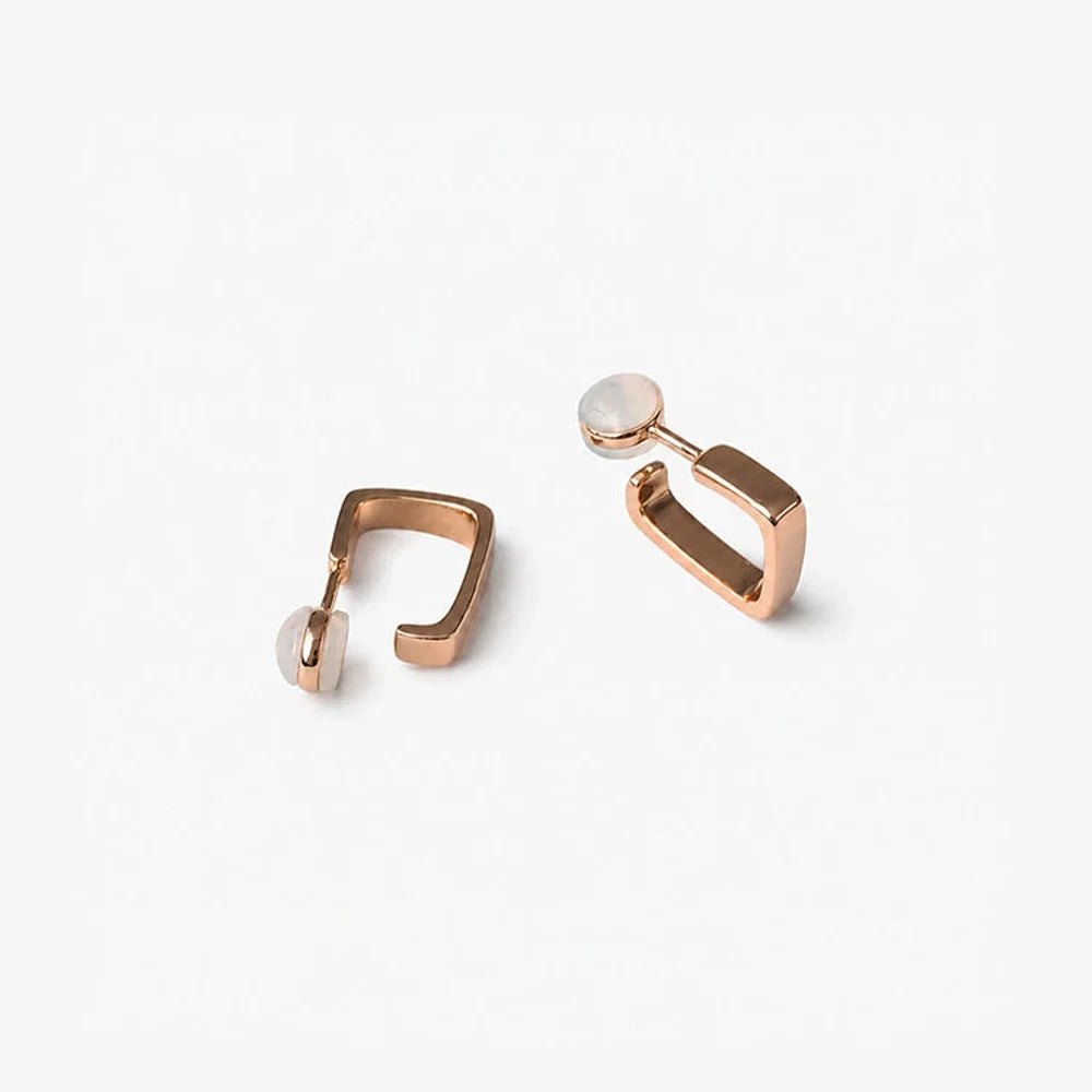 Rose gold square clip on hoop earrings showing the cushioned clip on closure