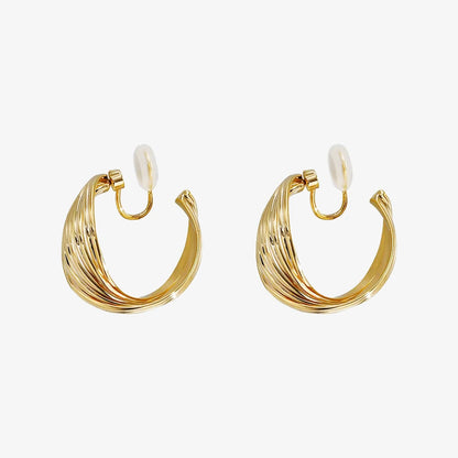 Front view of Rotating Spiral Clip-On Hoop Earrings in Gold showcasing the multiple string twist design.