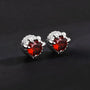Ruby Dragon Claw Magnetic Stud Earrings in Silver, pair view on dark background showing red gemstones with metallic claw design