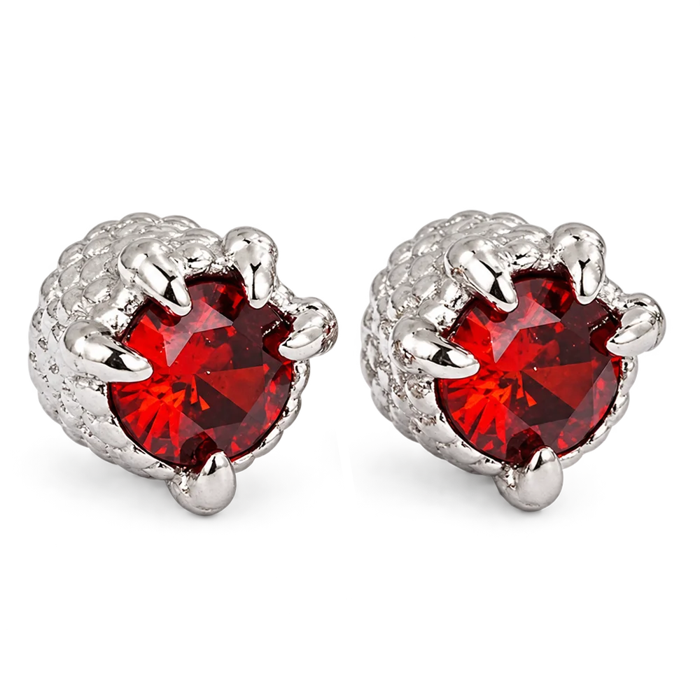 A pair of silver claw stud earrings featuring round red gemstones, set against a plain white background.