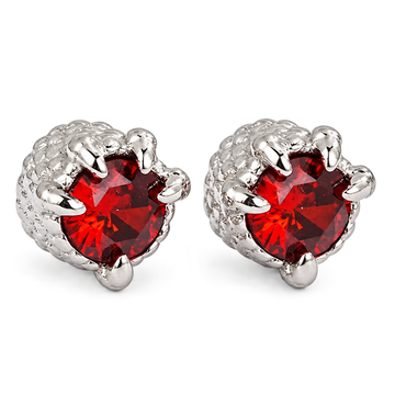 A pair of silver claw stud earrings featuring round red gemstones, set against a plain white background.