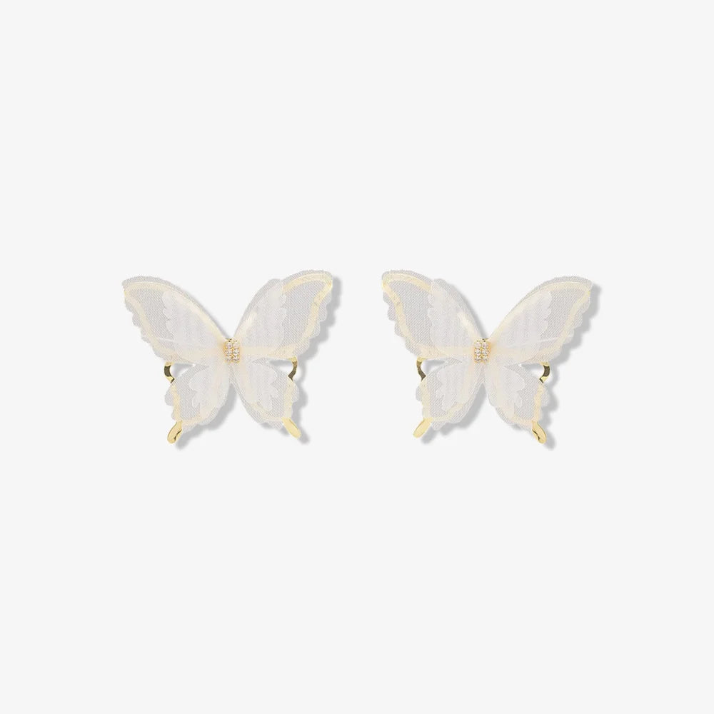 Pair of Silhouette Butterfly Wings Clip-On Earrings displayed on a jewelry stand, highlighting the intricate butterfly wing design.