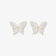 Pair of Silhouette Butterfly Wings Clip-On Earrings displayed on a jewelry stand, highlighting the intricate butterfly wing design.