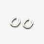 A pair of polished silver-toned metal hoop earrings with a unique rounded, open-ended design, displayed on a clean light gray background.