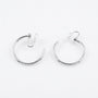 A pair of rotating silver hoop earrings with u-type closures, shown on a clean white background.