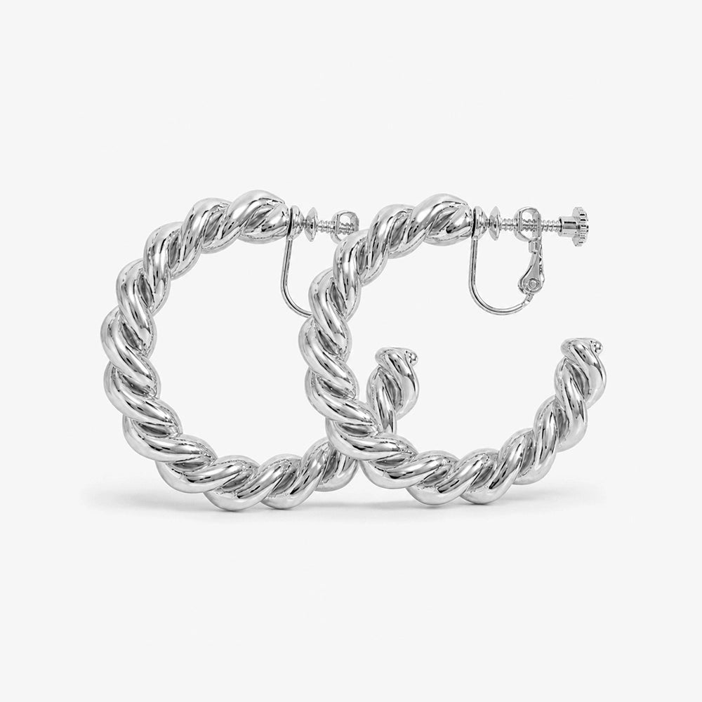 Silver hoop clip-on earrings feature a unique, modern design that elevates your everyday look. Crafted from alloy with a secure screw-back closure for comfortable wear, they're perfect for the office or a night out.