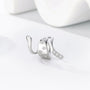 Silver snake ear cuff with zirconia accents, angled side view on white background