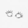A pair of silver-toned spiky clip on hoop earrings on a clean, light gray background.