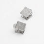 A pair of silver-toned square cufflinks, each featuring a pavé-set clear crystal face. The cufflinks are arranged diagonally on a clean, light off-white background.
