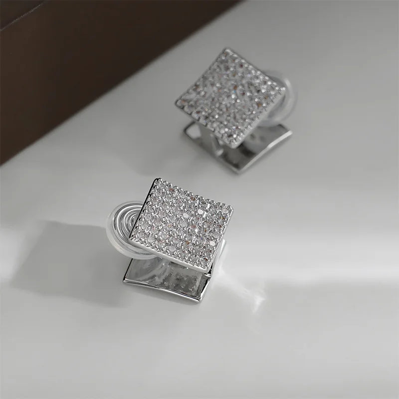 Close-up of the zircon side of the Square Pavé Clip-On Stud Earrings for a sparkling effect.