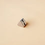 Triangle Magnetic Stud Earrings in Silver angled view on beige background