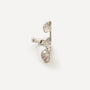 A silver cufflink designed like a branch with three textured, fan-like leaf or petal shapes, photographed on a clean, light off-white background.