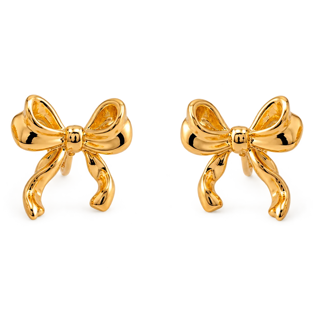A pair of gold bow-shaped stud earrings with a polished, reflective finish, displayed on a clean white background.