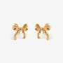 Gold simple bow clip on stud earrings front view on white background
