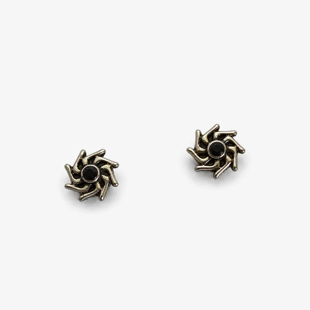 A pair of antique bronze spiral stud earrings with a small black center, displayed on a clean white background.