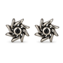 A pair of oxidized silver turbine-shaped stud earrings with a central black gemstone, shown on a clean white background.