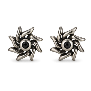 A pair of oxidized silver turbine-shaped stud earrings with a central black gemstone, shown on a clean white background.