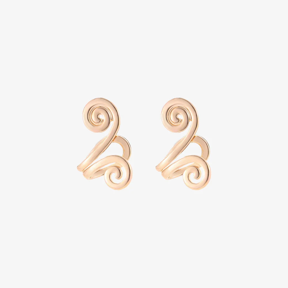 Spiral Helix Tragus Cuff in Gold on a white background, showcasing its polished finish.