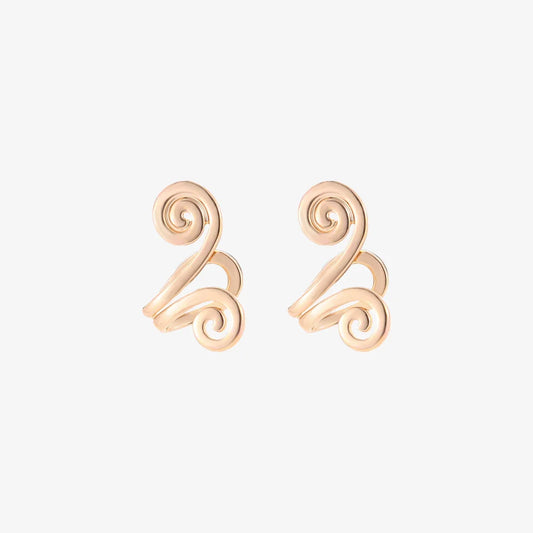 Spiral Helix Tragus Cuff in Gold on a white background, showcasing its polished finish.