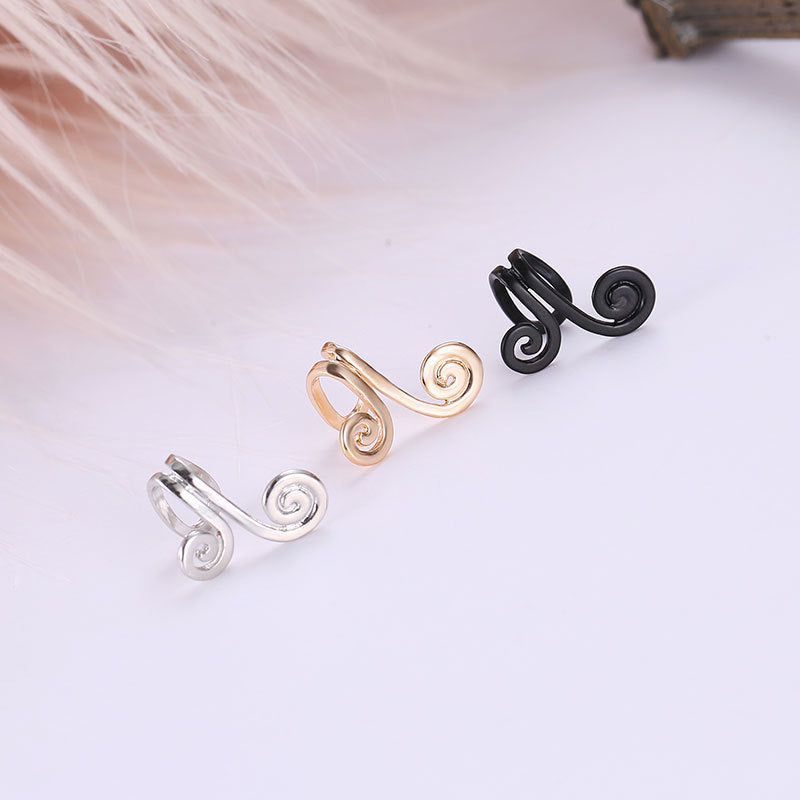 Spiral helix tragus cuff in silver, gold, and black finishes displayed in a row on white background
