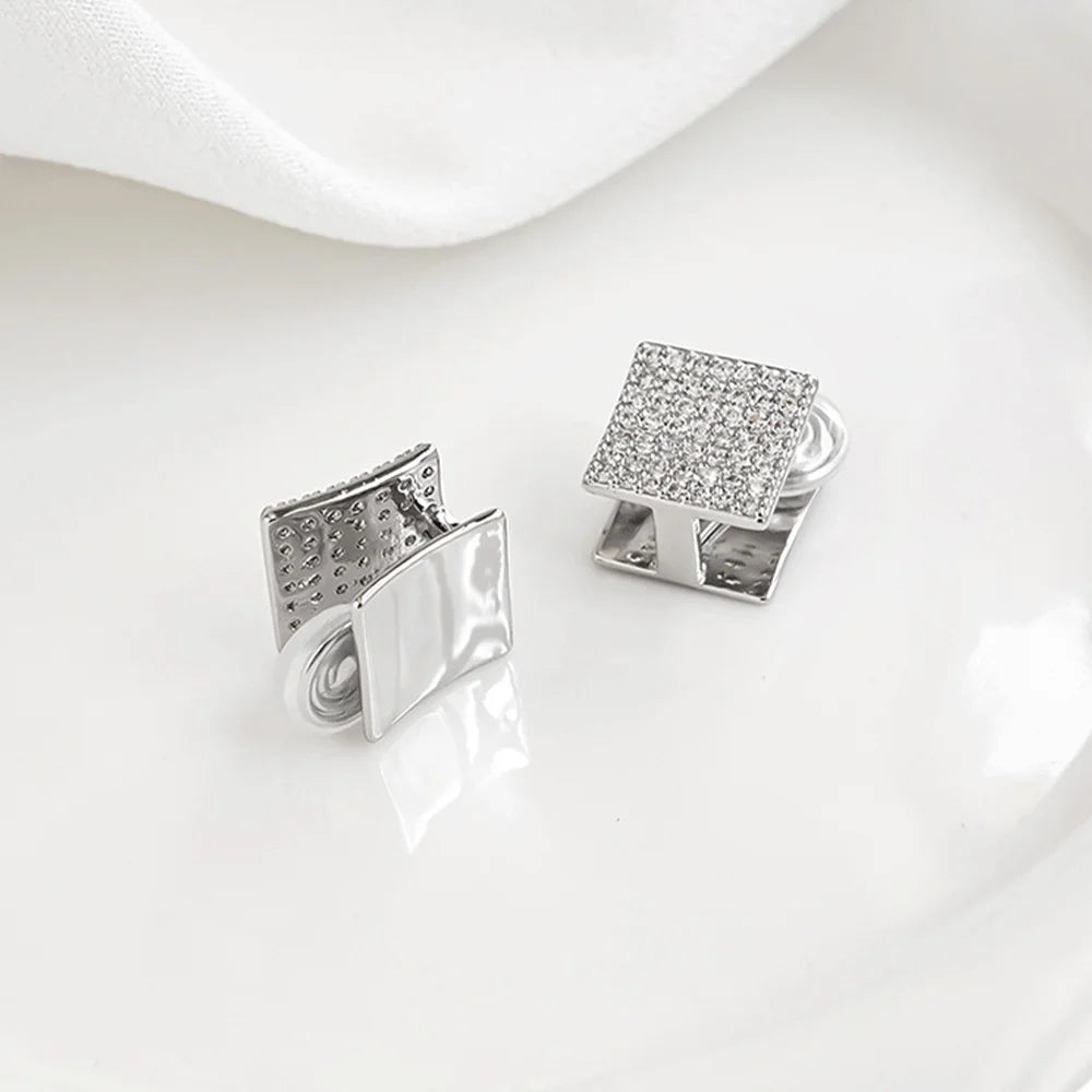 Another angle of the front and back of Square Pavé Clip-On Stud Earrings highlighting their versatility.