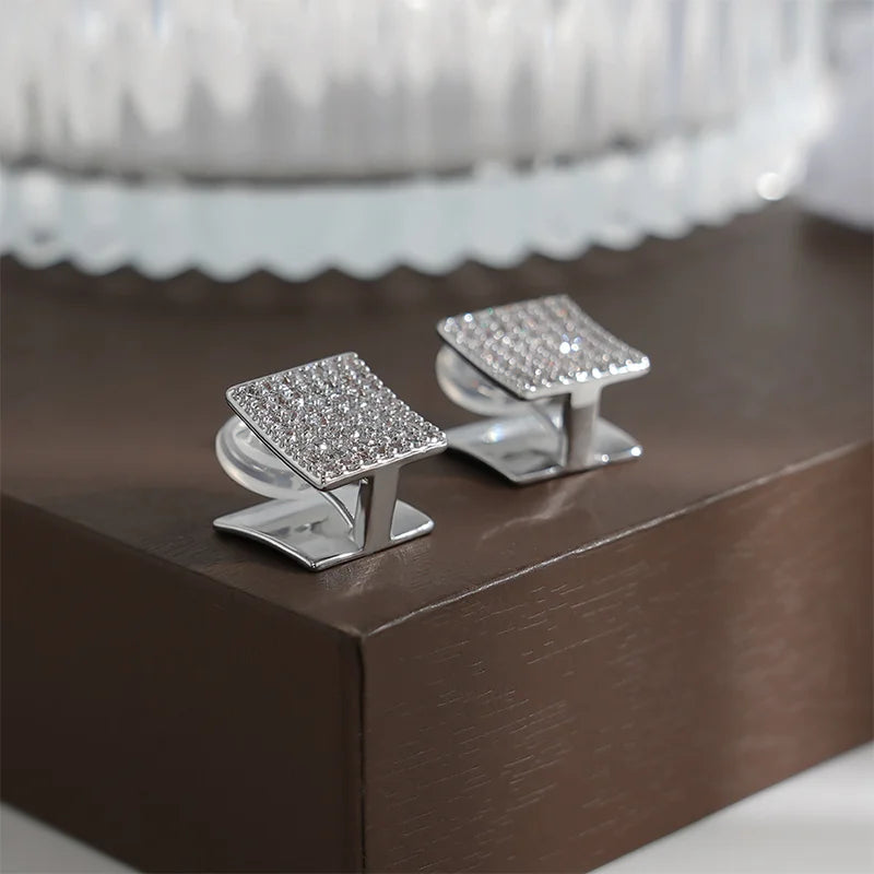 Detailed view of the polished smooth side of Square Pavé Clip-On Stud Earrings, emphasizing their sleek design.


