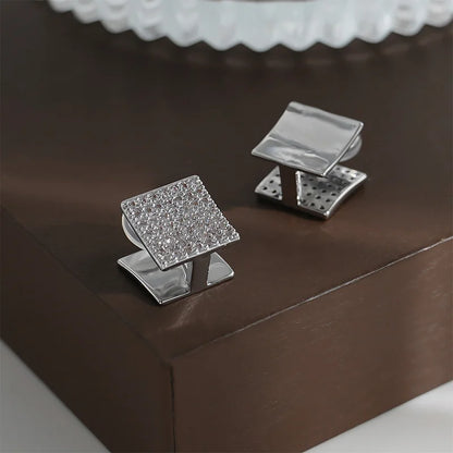 Front and back view of Square Pavé Clip-On Stud Earrings showing the zircon side and smooth side.