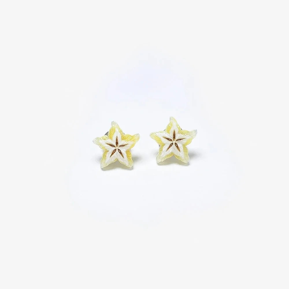 A pair of small star-shaped stud earrings with a pale yellow and white textured design, shown on a plain white background.