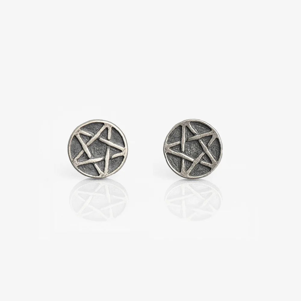 Front view of the aged star magnetic earrings, highlighting the detailed texture and antique finish.