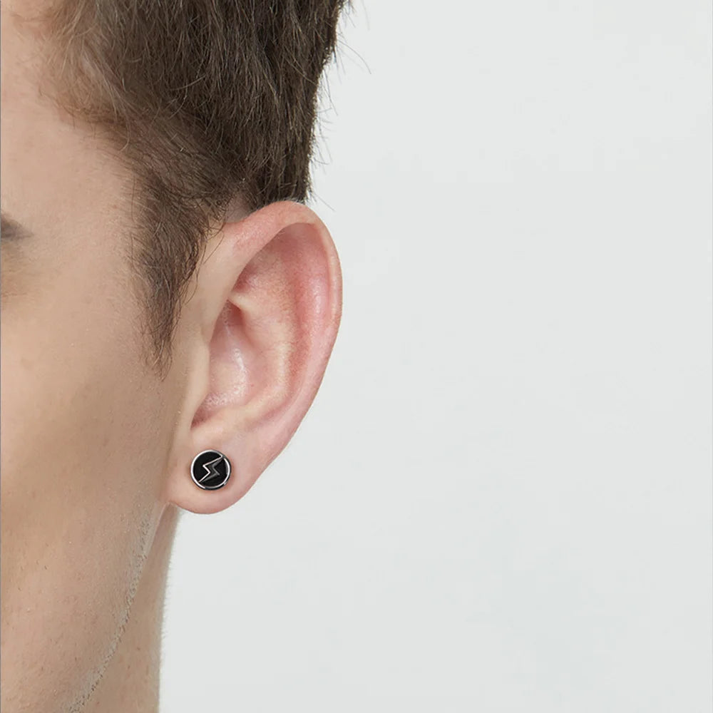 Silver Lightning Bolt Magnetic Stud Earrings side view worn on male ear against white background