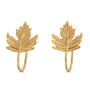 A pair of gold maple leaf hoop earrings with a textured, hammered finish, displayed on a clean white background.