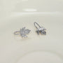 Sterling silver maple leaf cuff earrings displayed on white background, showing front and side angles