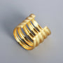 Gold sterling silver multi-band ear cuff angled side view on gray background