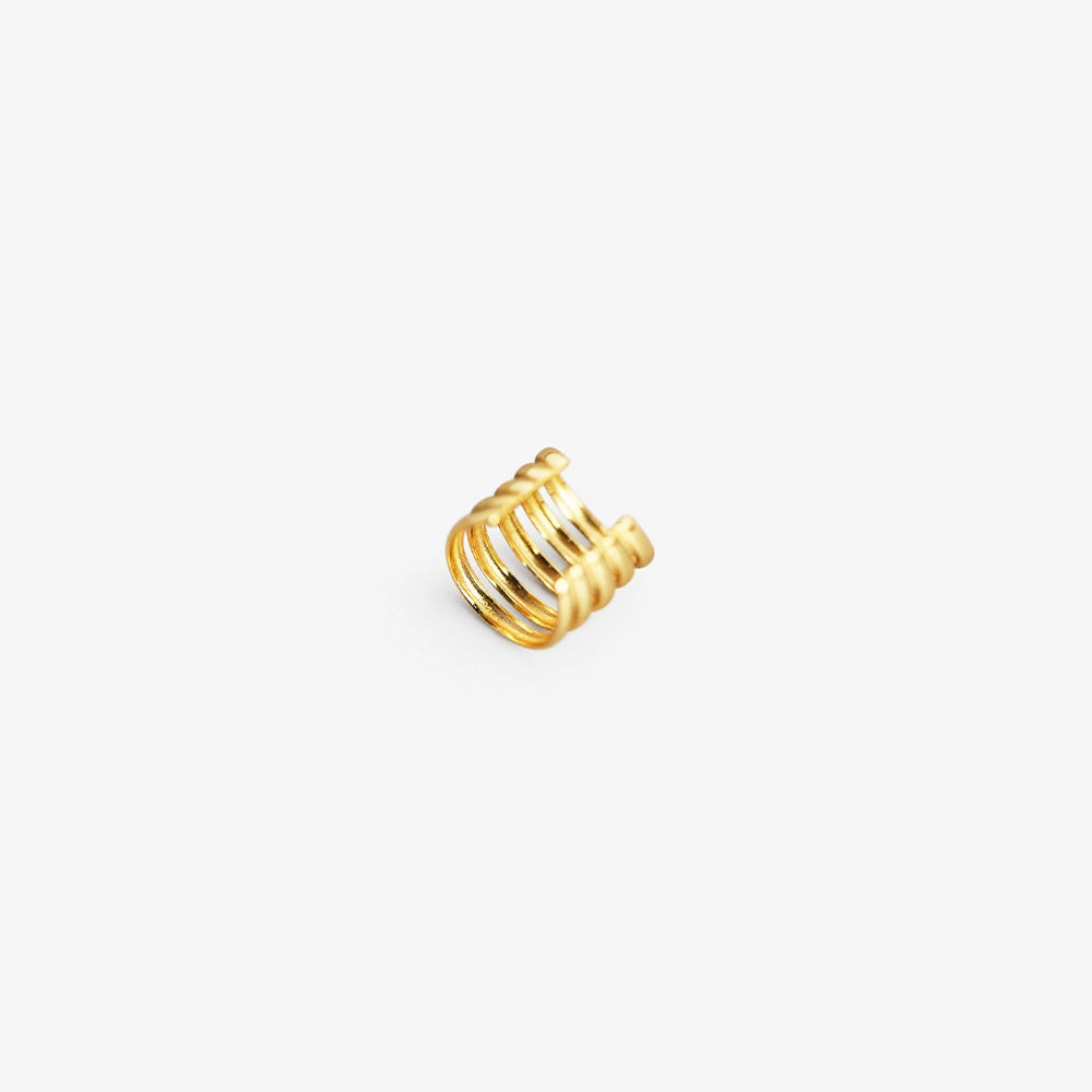 Gold sterling silver multi-band ear cuff angled side view on gray background