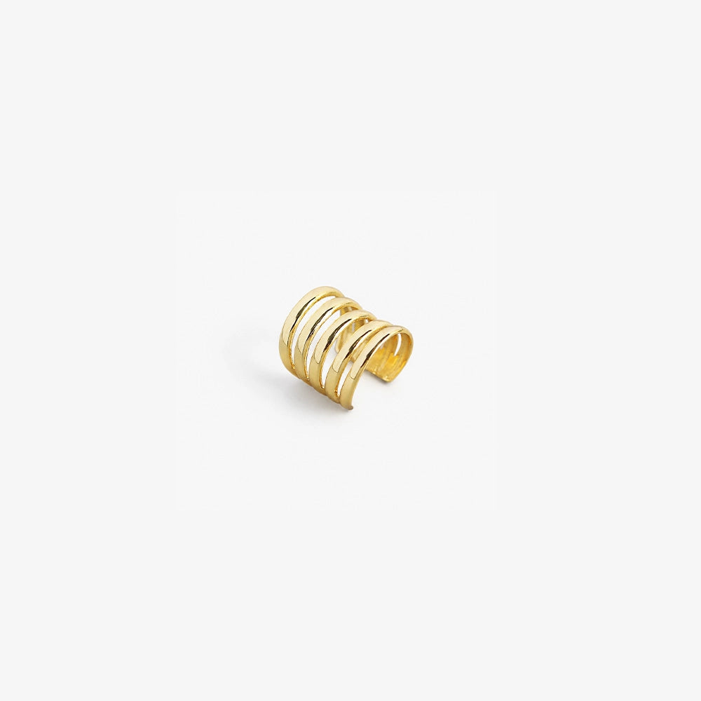 Gold sterling silver multi-band ear cuff shown at an angle on white background, displaying layered curved design