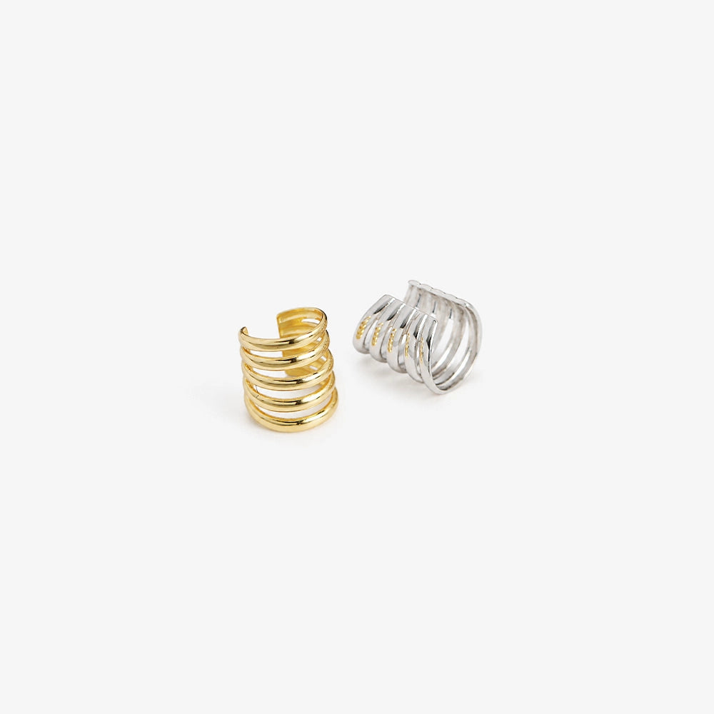 Sterling silver multi-band ear cuff in white gold displayed on white background showing polished finish