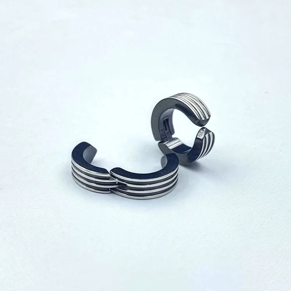 Black striped hoop clip-on earrings for men with triple-line detail

